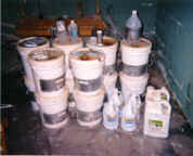 Pails of warehoused small containers for disposal